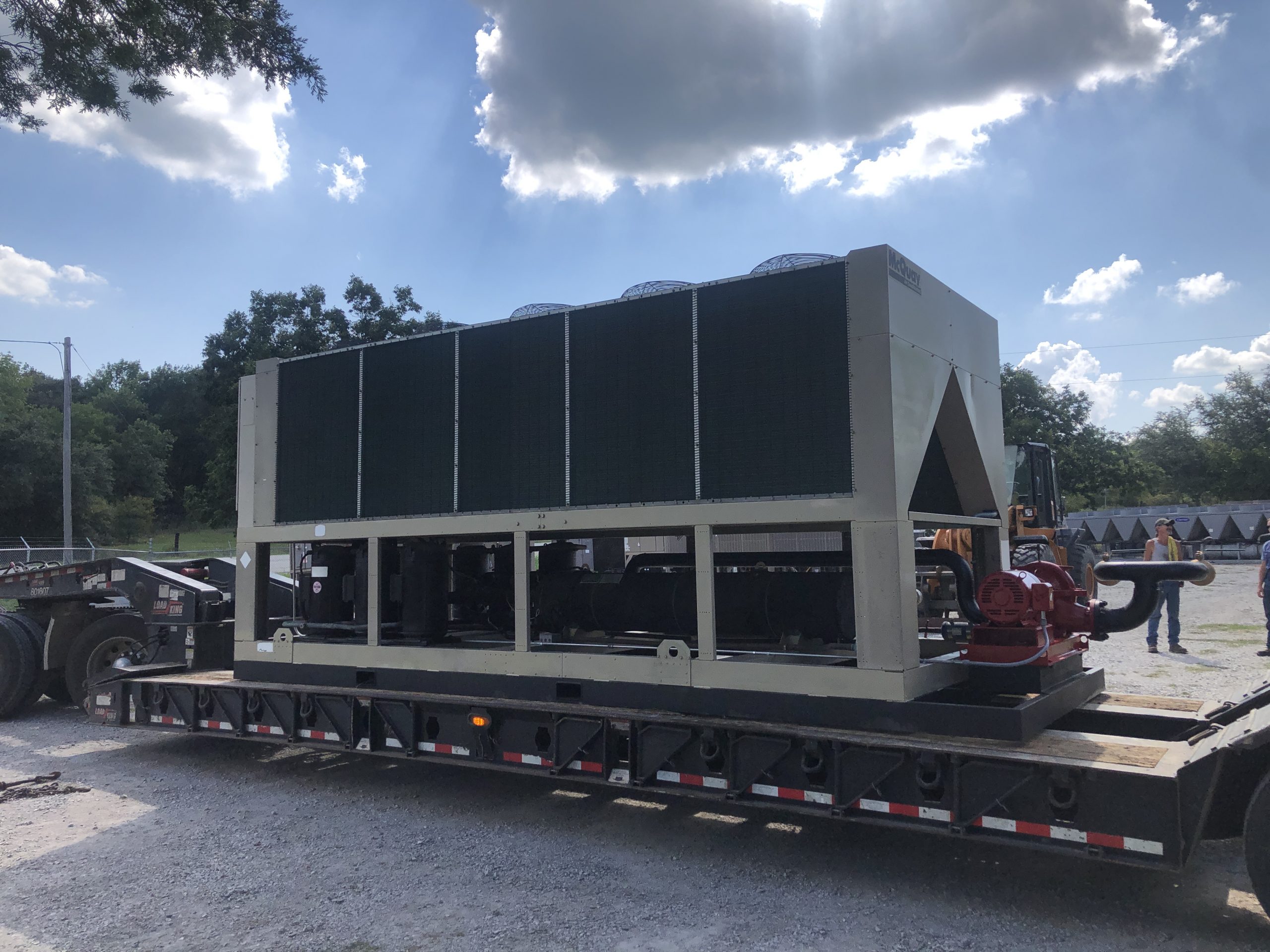 Used 180 Ton McQuay Air Cooled Chiller mounted on a custom forkable skid with a Used 15HP Weinman Pump